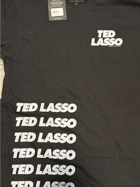 Junk Food Clothing Black Tee with White 'TED LASSO' Repeat Graphic